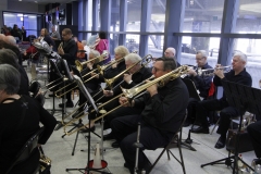 Trumpets and trombones performing at Welcome Home Honor Flight performance on April 7, 2018, at ROC International Airport . Photo by Patricia Elliott.